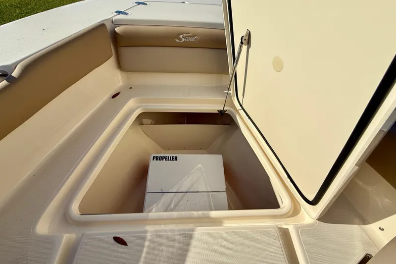 Slide: The Image of Open storage compartment in 2025 Scout 195 Sport Dorado boat, showing propeller box. - 27