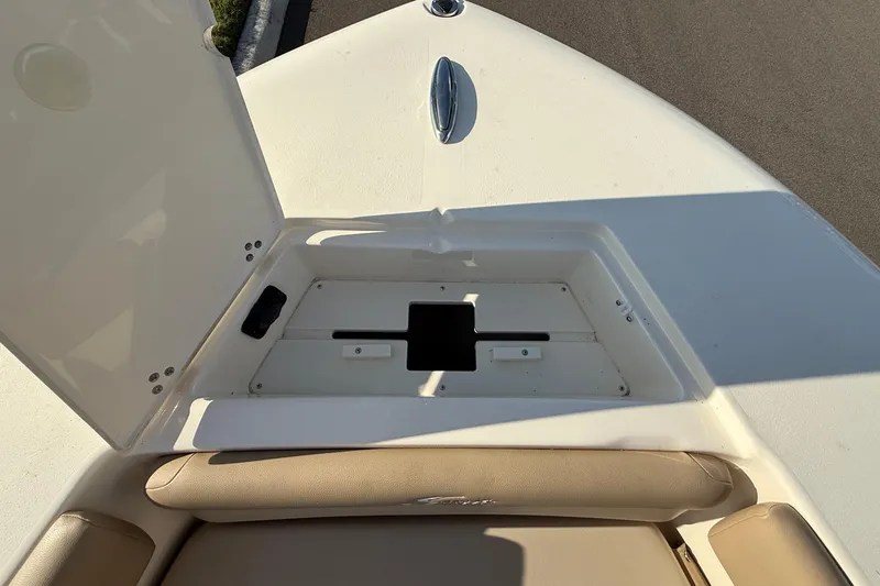 Slide: The Image of 2025 Scout 195 Sport Dorado boat storage compartment with open hatch. - 28