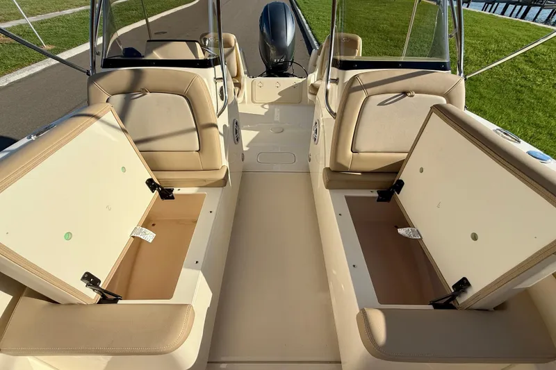 Slide: The Image of 2025 Scout 195 Sport Dorado boat interior with open storage compartments. - 35
