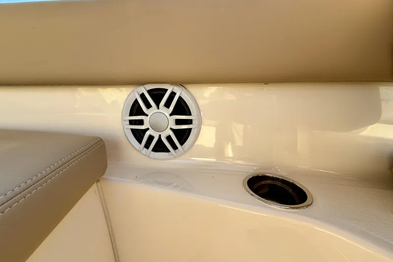 Slide: The Image of 2025 Scout 195 Sport Dorado boat interior with speaker and cup holder. - 39
