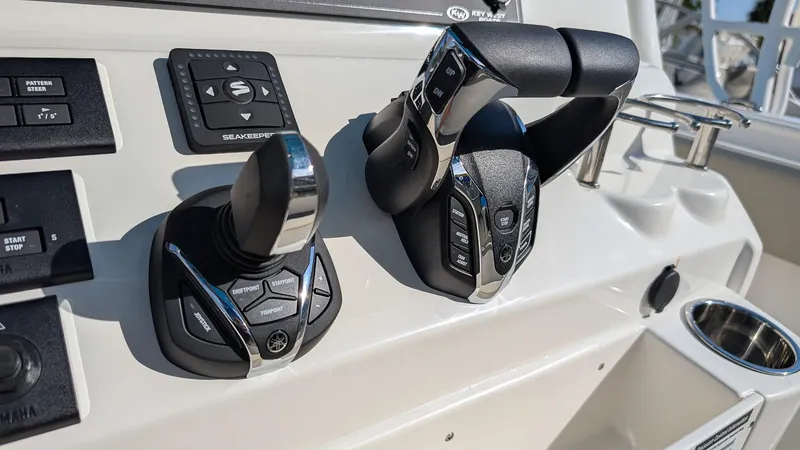 Slide: The Image of Control panel of 2025 Key West 263 FS boat with advanced throttle and joystick. - 10