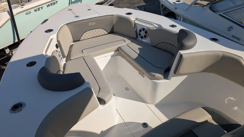 Slide: The Image of 2025 Key West 263 FS boat interior with cushioned seating and modern design. - 12