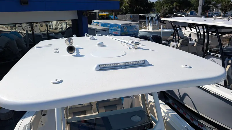 Slide: The Image of 2025 Key West 263 FS boat roof with mounted equipment in a marina setting. - 16