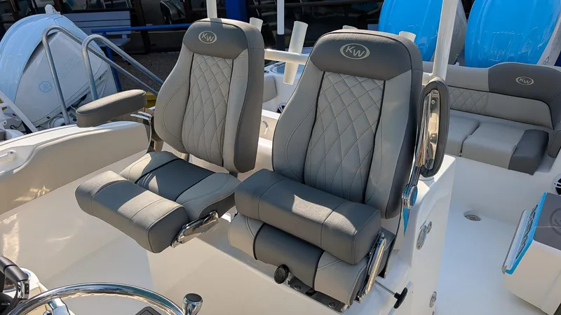 Slide: The Image of 2025 Key West 263 FS boat seats with gray upholstery and diamond stitching. - 8