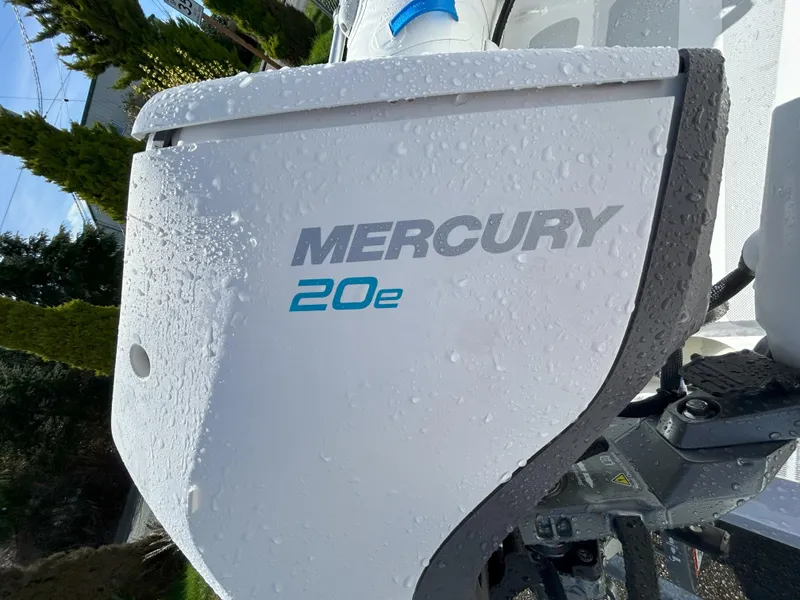 Slide: The Image of 2024 Zodiac Nomad 3.1 RIB Alu with Mercury 20e engine, wet with water droplets. - 12