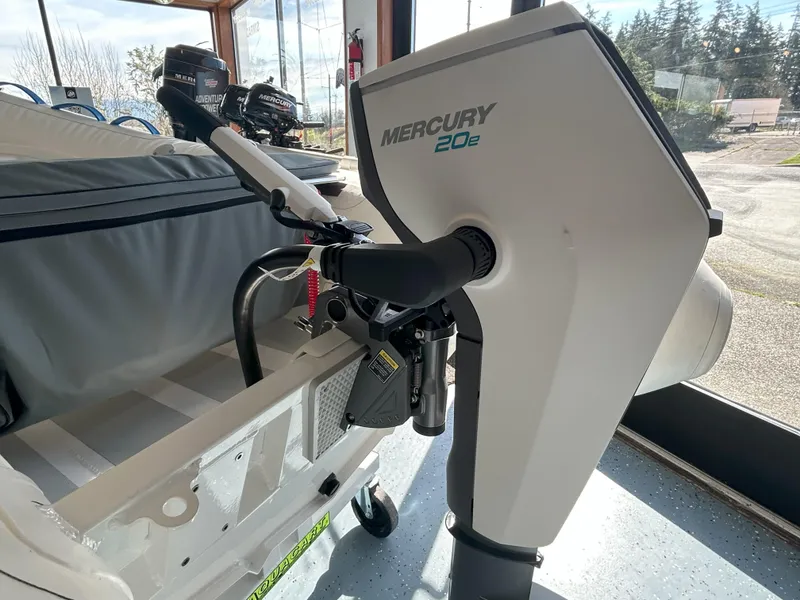 Slide: The Image of 2024 Zodiac Nomad 3.1 RIB Alu with Mercury 20e outboard motor in showroom. - 14