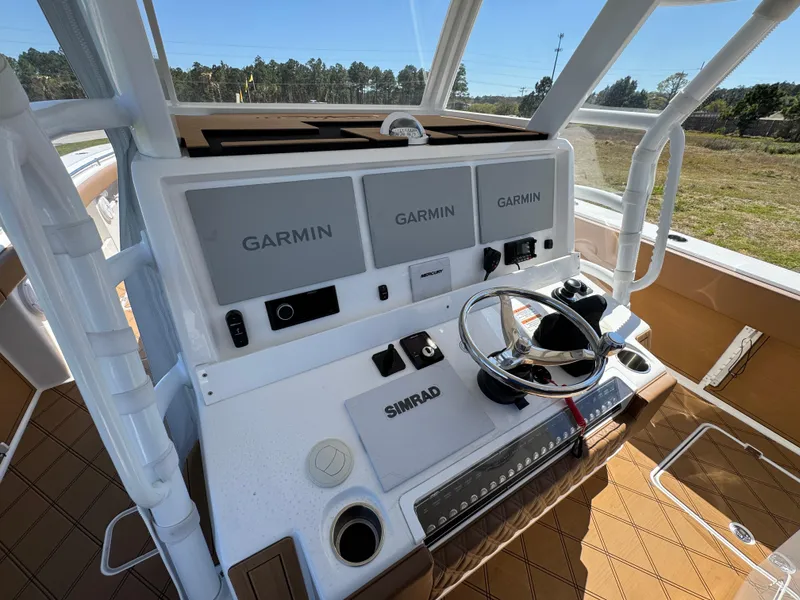 Slide: The Image of 2023 Invincible 37 Catamaran helm with Garmin displays and Simrad controls. - 29