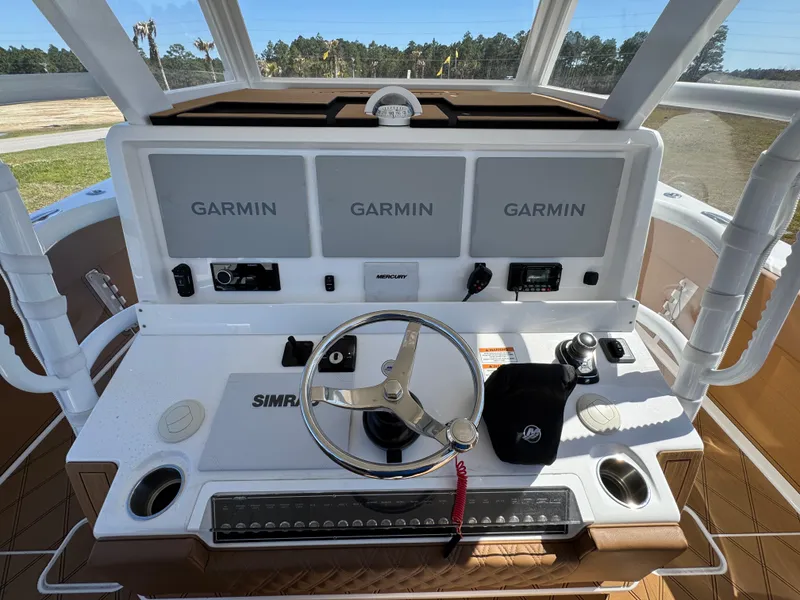 Slide: The Image of 2023 Invincible 37 Catamaran helm with Garmin displays and Simrad controls. - 30