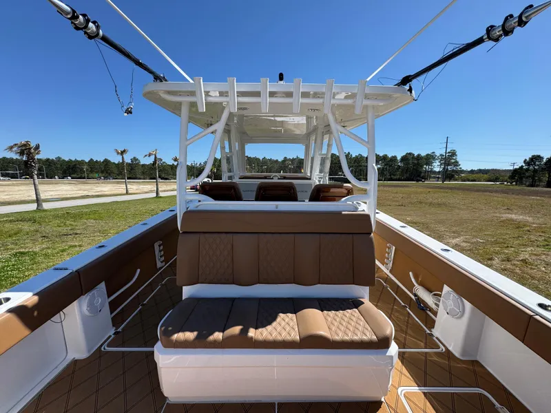 Slide: The Image of 2023 Invincible 37 Catamaran with tan seating, spacious deck, and modern design. - 36