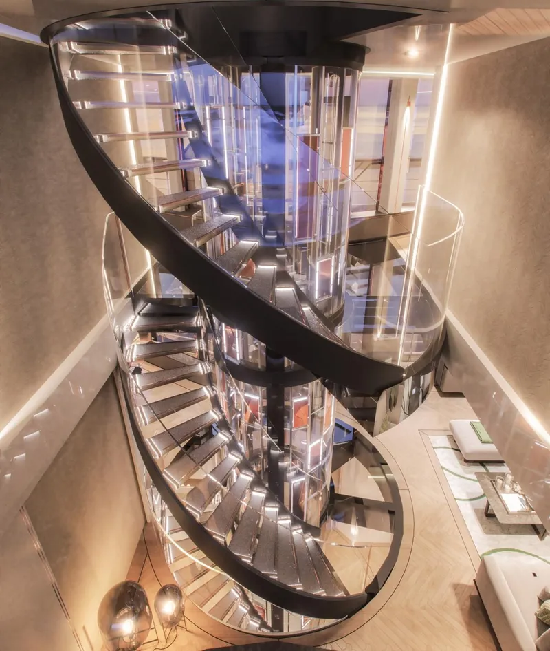 Slide: The Image of Luxurious spiral staircase on Prime Megayacht Maharani, 2026 model, with modern interior design. - 24