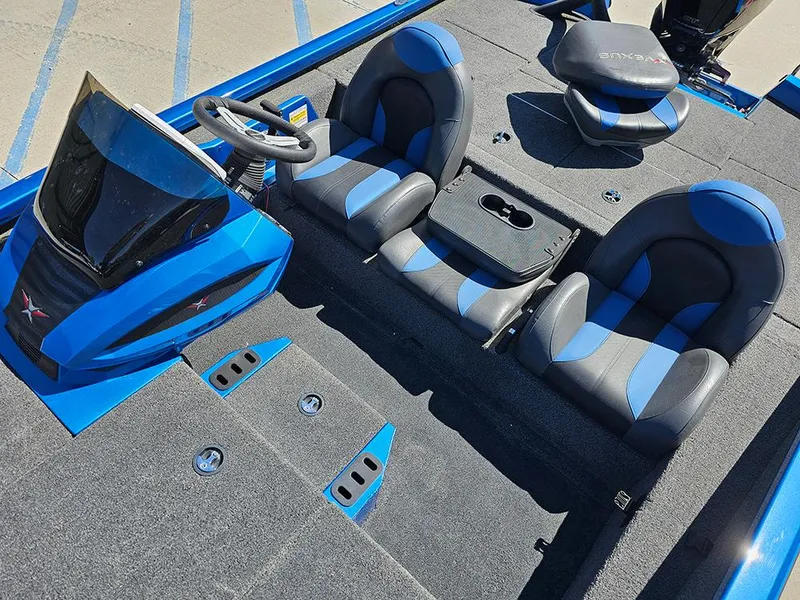 Slide: The Image of 2022 Vexus AVX1880 boat interior with blue and gray seating and steering console. - 12