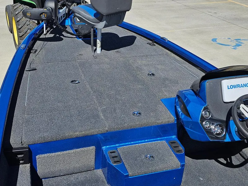 Slide: The Image of 2022 Vexus AVX1880 boat interior with blue accents and Lowrance electronics. - 16