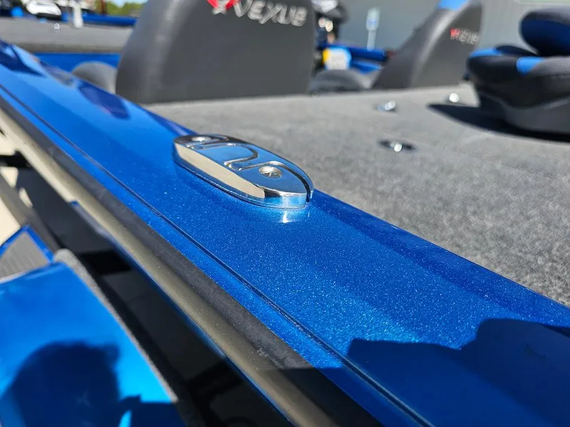 Slide: The Image of 2022 Vexus AVX1880 boat, blue metallic finish, close-up of deck cleat and seating. - 20