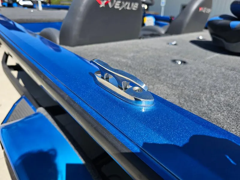 Slide: The Image of 2022 Vexus AVX1880 boat with blue metallic finish and cleat detail. - 21