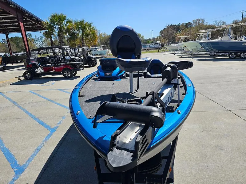 Slide: The Image of 2022 Vexus AVX1880 boat in a parking lot, featuring a sleek blue design. - 4