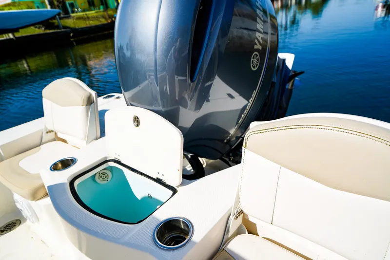 Slide: The Image of 2016 Robalo 206 Cayman boat with Yamaha engine, featuring seating and livewell. - 14