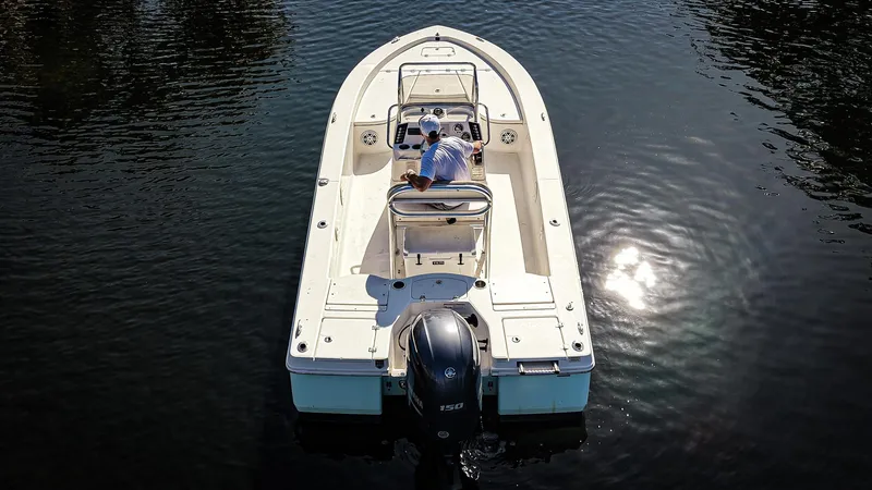 Slide: The Image of 2016 Robalo 206 Cayman boat on calm water, viewed from above, with sunlight reflection. - 19