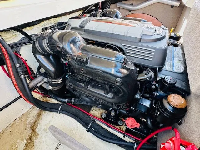 Slide: The Image of 2021 Stingray 225 SE engine compartment with visible components and wiring. - 16