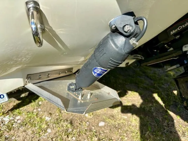 Slide: The Image of Trim tab on a 2021 Stingray 225 SE boat, enhancing stability and performance. - 3