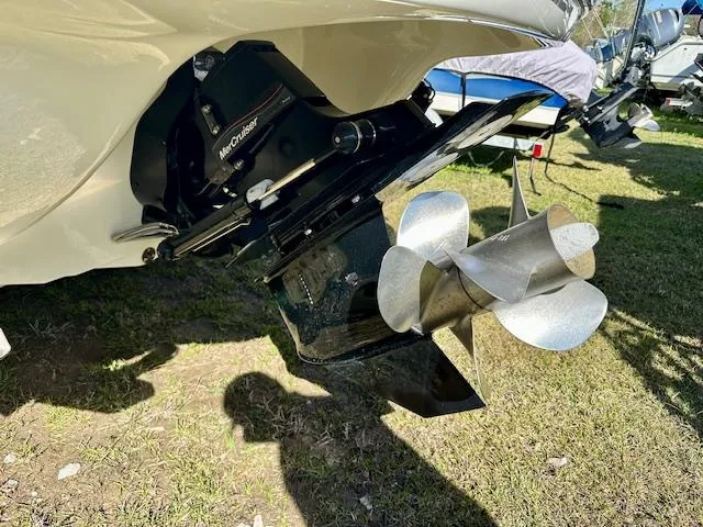 Slide: The Image of 2021 Stingray 225 SE boat with a stainless steel propeller on grass. - 4