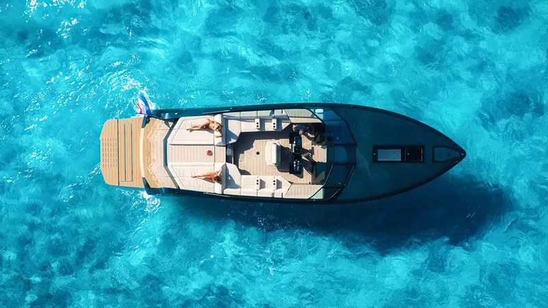 Slide: The Image of Aerial view of 2025 Waterdream California 52XT yacht on clear blue water. - 12