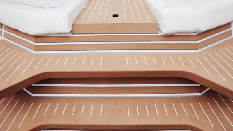 Slide: The Image of Luxury deck of 2025 Waterdream California 52XT yacht with sleek wooden design. - 15
