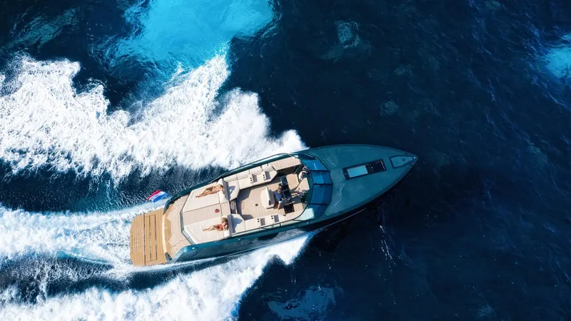 Slide: The Image of Aerial view of 2025 Waterdream California 52XT yacht cruising in deep blue ocean. - 6