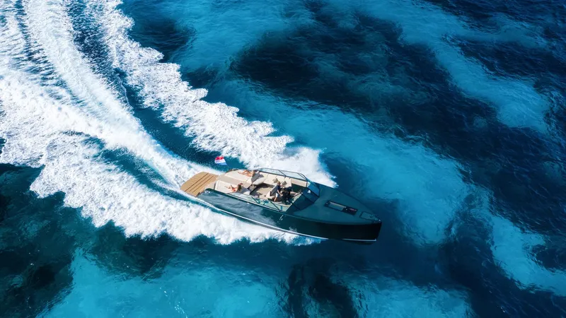 Slide: The Image of Aerial view of 2025 Waterdream California 52XT yacht cruising in clear blue ocean. - 7