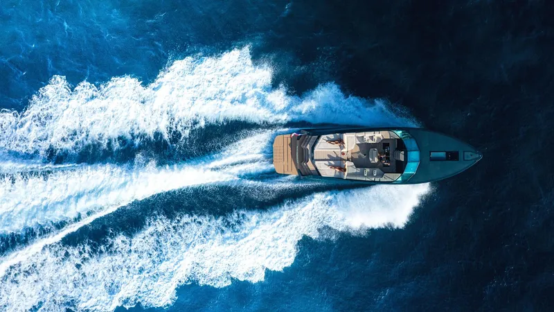 Slide: The Image of Aerial view of 2025 Waterdream California 52XT yacht cruising on blue ocean waters. - 8