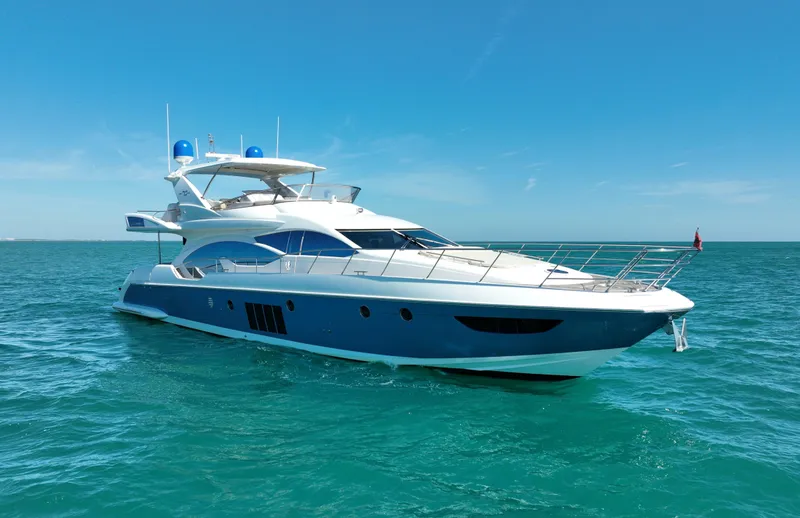 Slide: The Image of Luxury 2014 Azimut 70 yacht cruising on clear blue waters. - 0