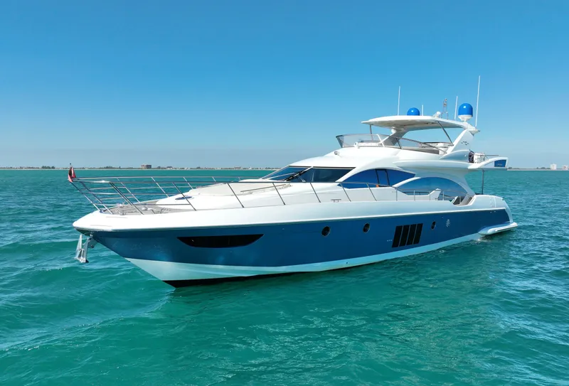 Slide: The Image of Luxury 2014 Azimut 70 yacht cruising on clear blue waters. - 11