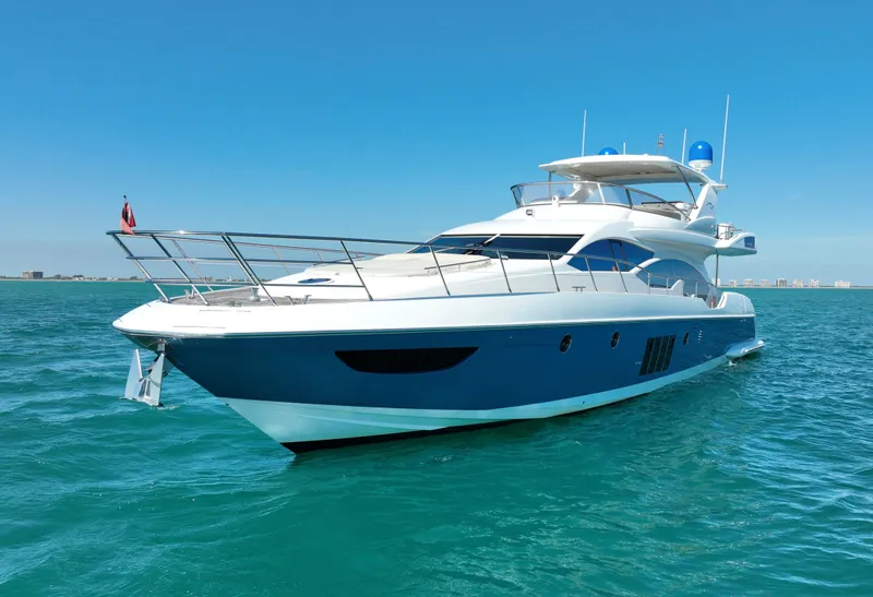 Slide: The Image of Luxury 2014 Azimut 70 yacht cruising on clear blue waters. - 12