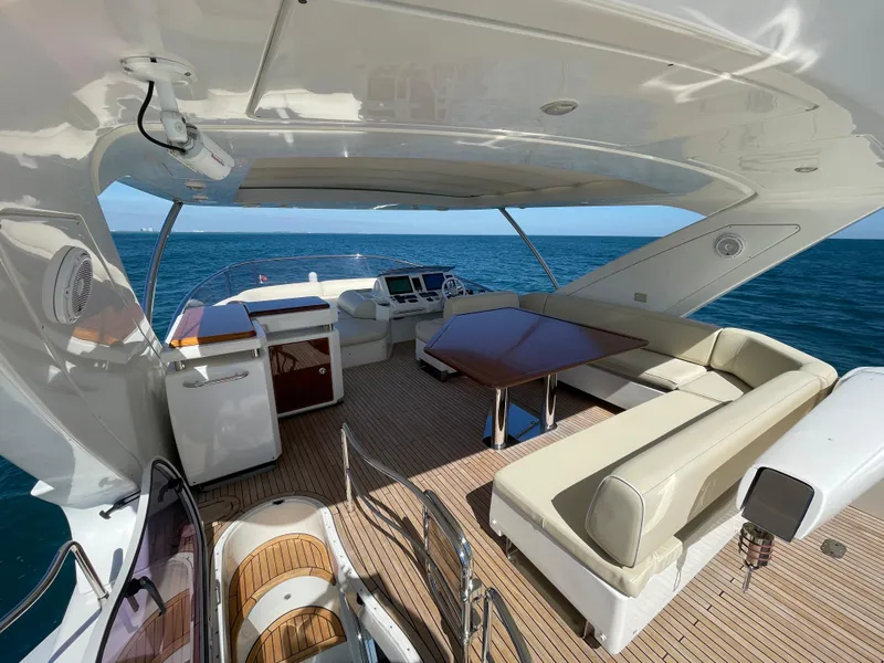 Slide: The Image of Luxurious 2014 Azimut 70 yacht interior with elegant seating and ocean view. - 29