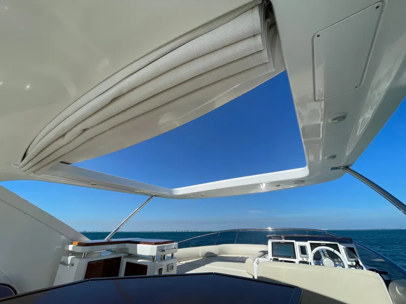 Slide: The Image of Luxurious 2014 Azimut 70 yacht interior with open sunroof and ocean view. - 31