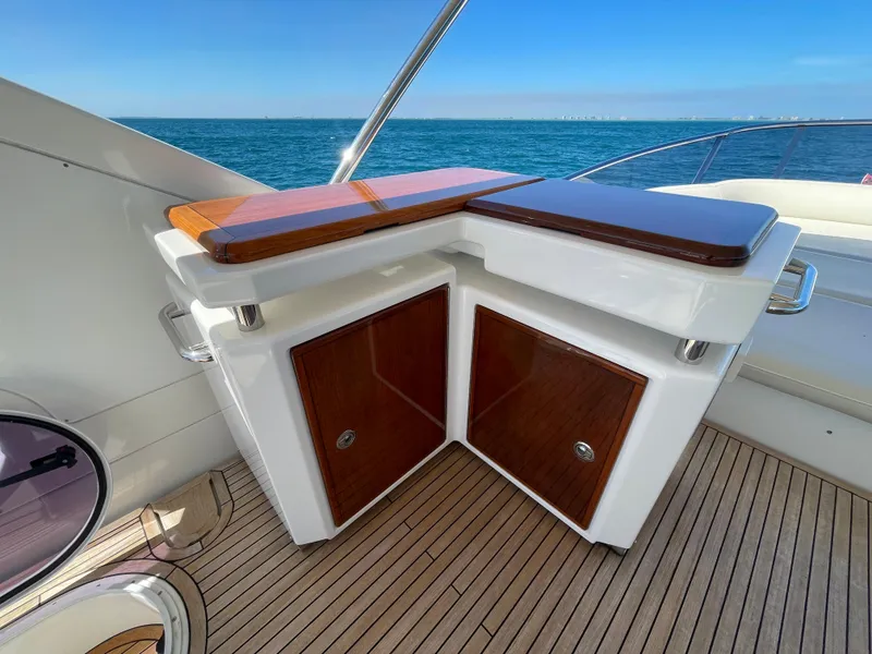 Slide: The Image of Luxurious 2014 Azimut 70 yacht deck with elegant wood cabinetry and ocean view. - 32