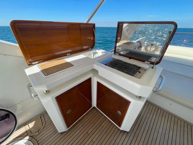 Slide: The Image of Outdoor kitchen on 2014 Azimut 70 yacht with wooden cabinets and sea view. - 33