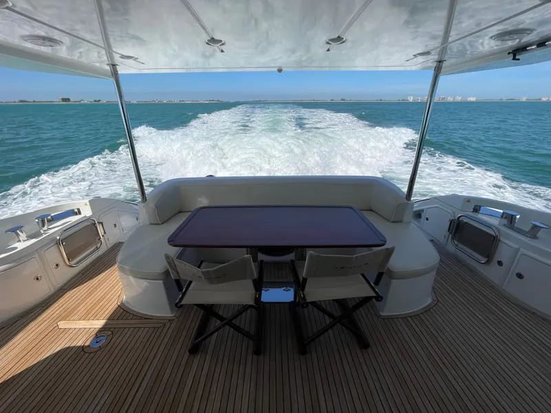 Slide: The Image of Luxurious 2014 Azimut 70 yacht cruising on open sea with elegant deck seating. - 38