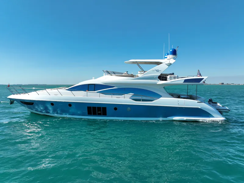 Slide: The Image of Luxury 2014 Azimut 70 yacht cruising on clear blue waters under a sunny sky. - 9