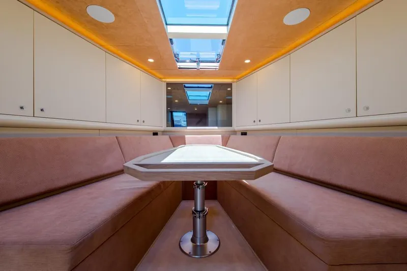 Slide: The Image of Luxurious interior of 2025 Waterdream California 52XT Hardtop yacht with skylight and seating area. - 10
