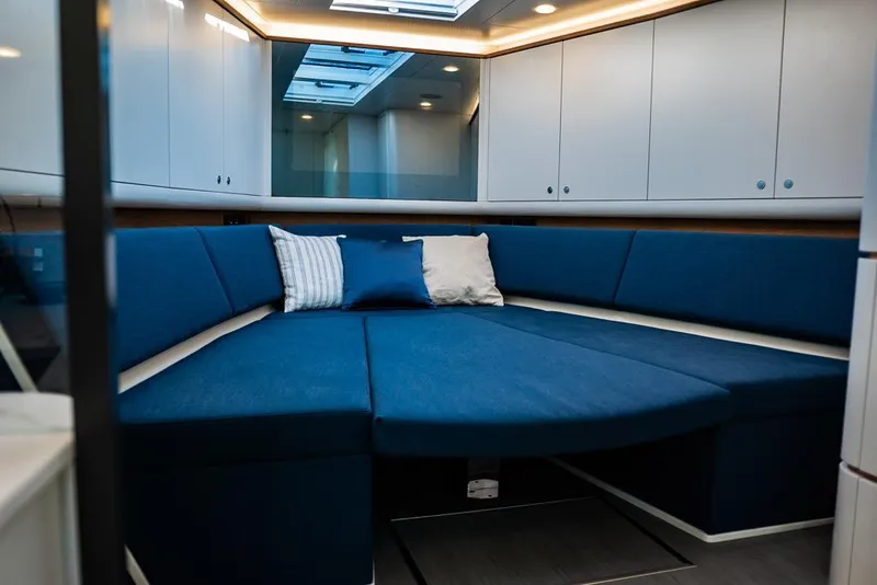 Slide: The Image of Interior of 2025 Waterdream California 52XT Hardtop with blue seating and modern design. - 15