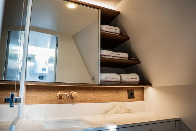 Slide: The Image of Luxurious bathroom interior of 2025 Waterdream California 52XT Hardtop yacht with modern fixtures. - 16