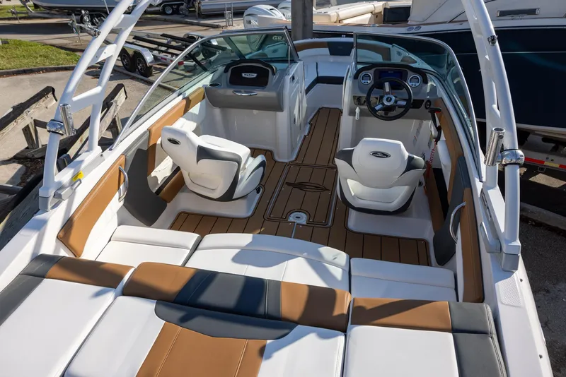 Slide: The Image of 2023 Chaparral 21 SSi OB boat interior with stylish seating and modern dashboard. - 13