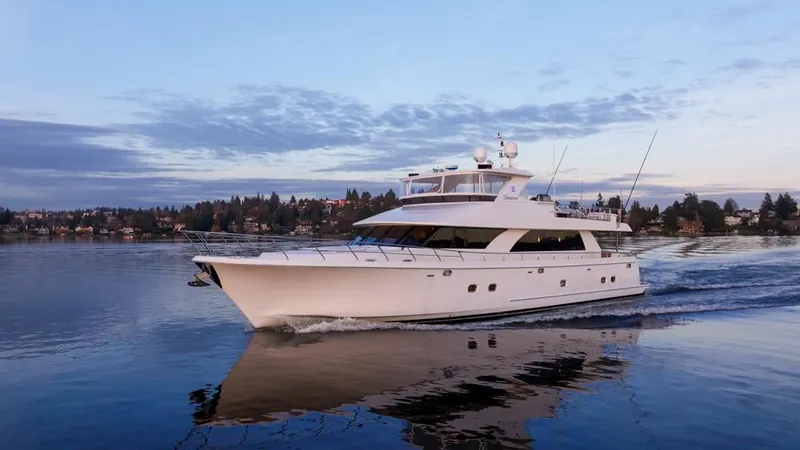 The Image of 2010 Ocean Alexander 80' Motoryacht cruising on calm waters at sunset. - 0