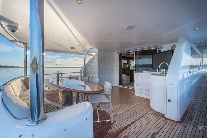 Slide: The Image of Luxurious Ocean Alexander 80' Motoryacht 2010 with elegant deck seating and ocean view. - 10