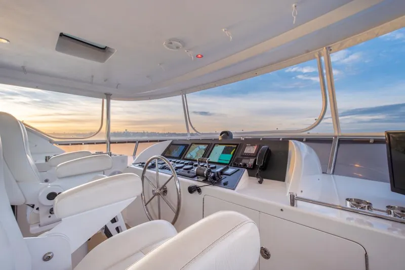 Slide: The Image of Cockpit of 2010 Ocean Alexander 80' Motoryacht with modern navigation equipment at sunset. - 12