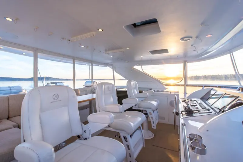 Slide: The Image of Luxurious interior of 2010 Ocean Alexander 80' Motoryacht with white seating and panoramic windows. - 14