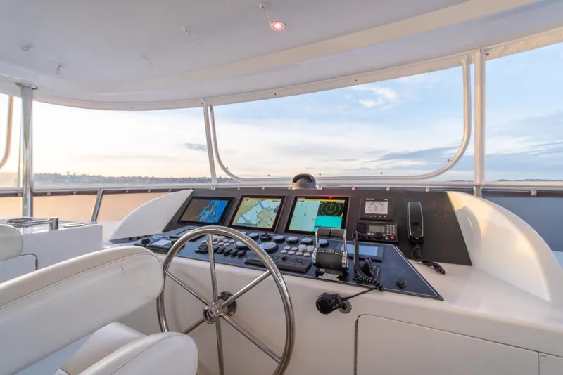 Slide: The Image of Cockpit of 2010 Ocean Alexander 80' Motoryacht with navigation screens and steering wheel. - 15