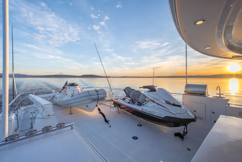 Slide: The Image of Luxurious 2010 Ocean Alexander 80' Motoryacht deck with jet ski and tender at sunset. - 16