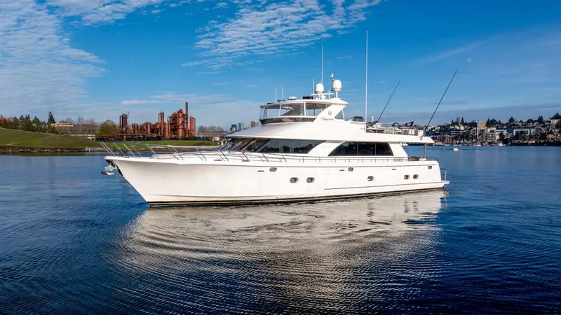Slide: The Image of 2010 Ocean Alexander 80' Motoryacht cruising on a calm, scenic waterway. - 2