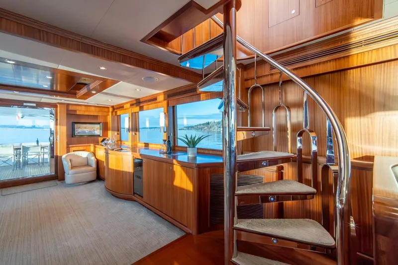 Slide: The Image of Luxurious interior of 2010 Ocean Alexander 80' Motoryacht with elegant wood finishes and spiral staircase. - 21
